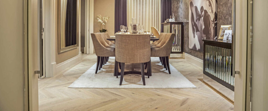 Modern luxury dining room with round table and upholstered chairs
